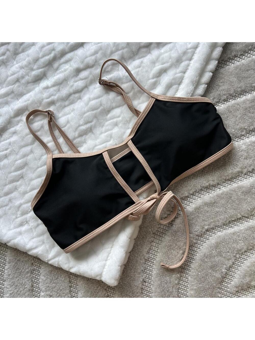 Black swimsuit top with beige trim and tie detail #swimwear #beachwear
